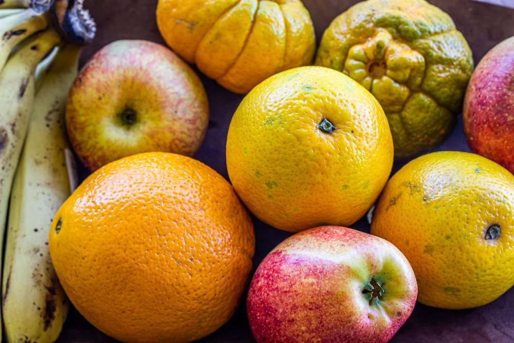 Assortment of fruit including bananas, organes and apples