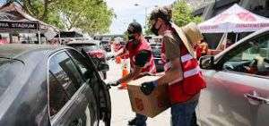 Salvation Army volunteers distributing food boxes