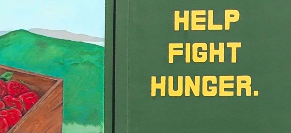 Portion of the Merced County Food Bank mural that shows "Help Fight Hunger"