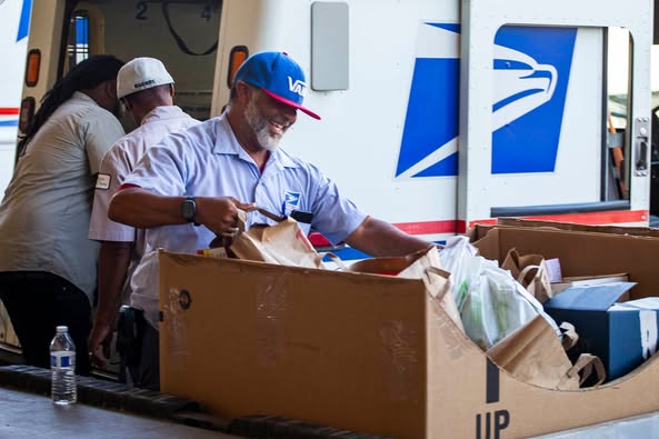 Postal Workers collecting Food.